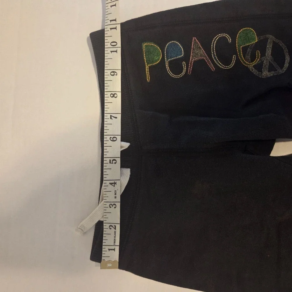 Super cozy black Hanes sweat shorts featuring a vibran